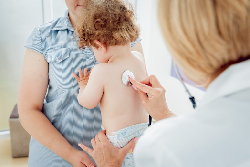 Friendly doctor pediatrician with patient child at clinic Friendly doctor pediatrician with patient child at clinic. Diagnostic, healthcare, medical service